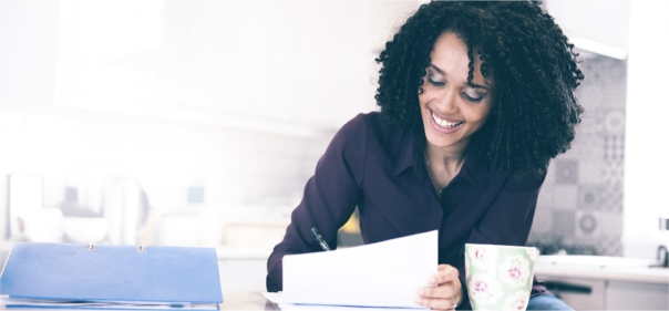 Smiling Arden University student at home