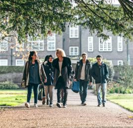 Arden University students walking at Mancheater study centre