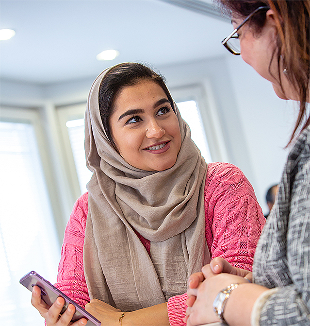 Arden University students discussing their application