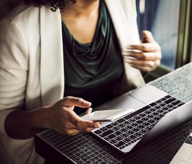 Woman typing on a laptop