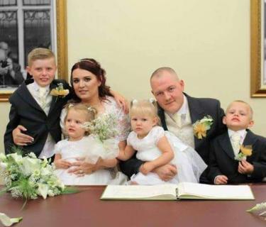 Wedding photo of an Arden student with his family