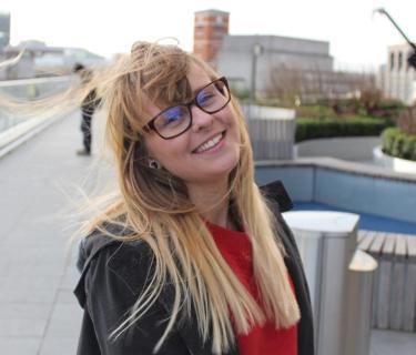 Arden student standing outside of a building