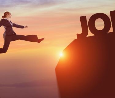 Woman leaping towards JOB letters