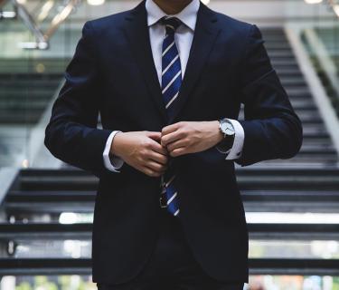Man in suit on stairs