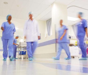 Nurses and doctors walking in hospital