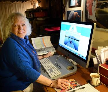 Woman sitting at a desktop computer