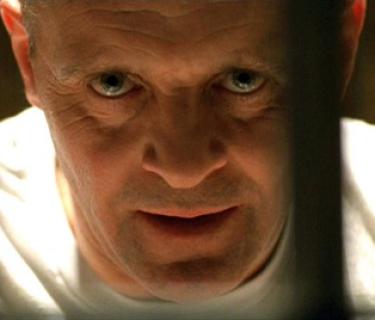 Man looking through prison bars