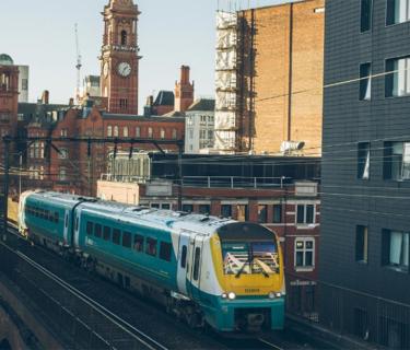 Train running through a city