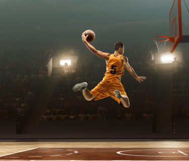 man playing basketball on court
