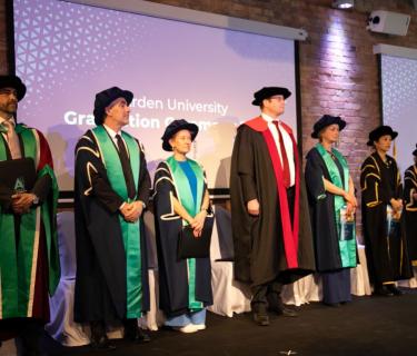 our academics assemble on the stage