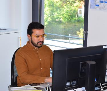 Aayush at a computer