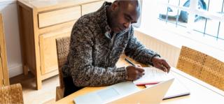 Arden University student studying at home