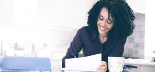Smiling Arden University student at home