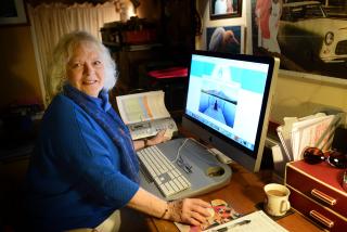 Val Bishop studying at her computer