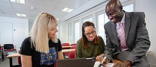 Blended Learning Students with tutor at Arden University study centre