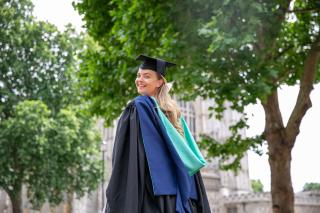 Arden student in front of trees